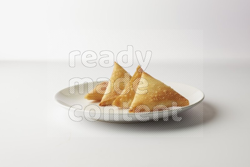 sambosas on a white background