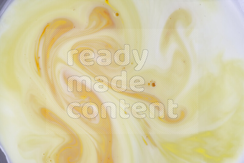 A close-up of abstract different swirling patterns in orange