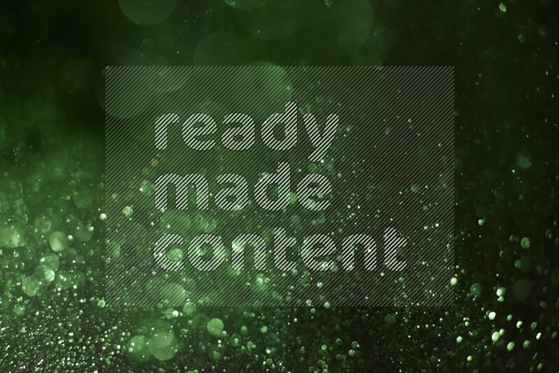 Green glitter powder isolated on black background