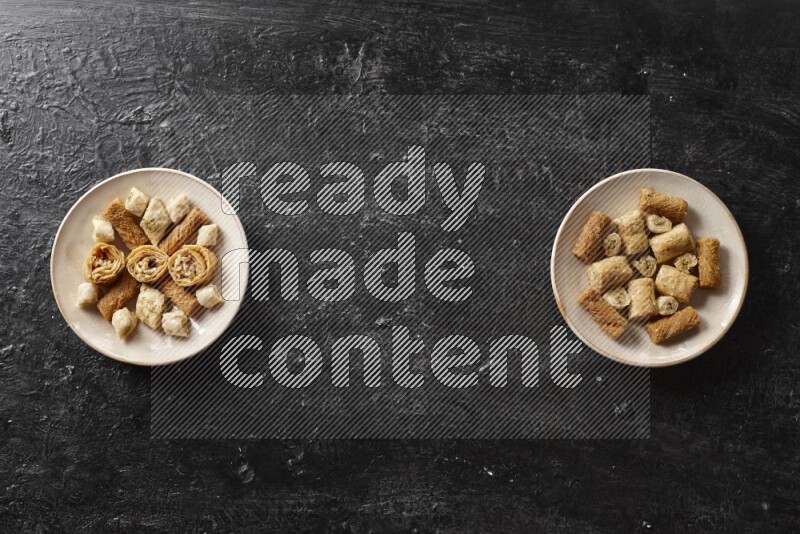 Oriental sweets in pottery plates in a dark setup