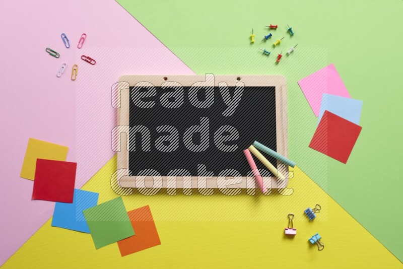 Different school supplies on multicolored background