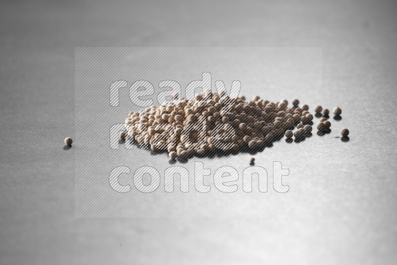 White pepper on a black flooring