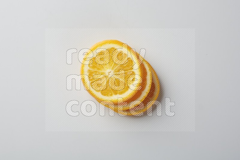 Three orange slices on a white background