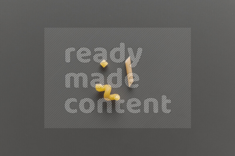 Different pasta types on grey background
