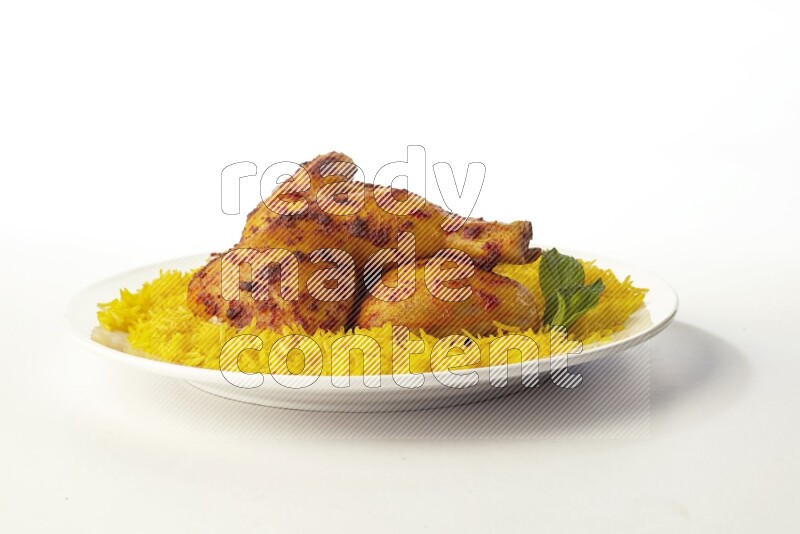 yellow basmati Rice with kabsa chicken pieces on a white rounded plate direct on white background