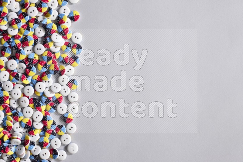 Multicolored buttons placed on grey background