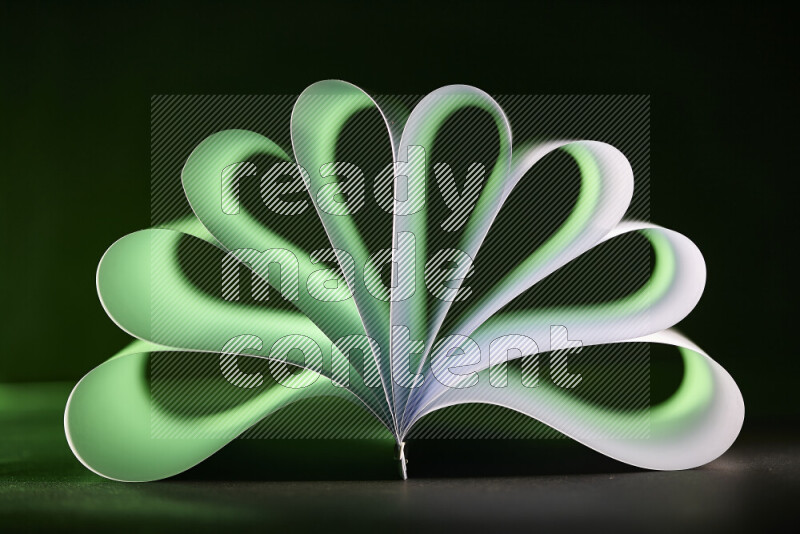 An abstract art piece displaying smooth curves in green and white gradients created by colored light