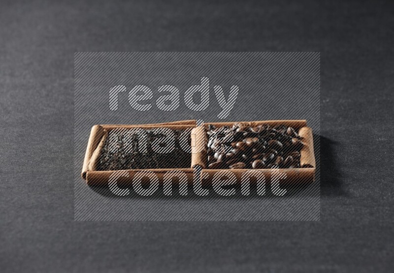 2 squares of cinnamon sticks full of coffee beans and tea on black flooring