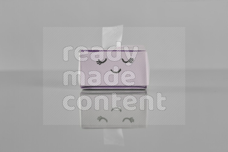 Origami tissue box on grey background