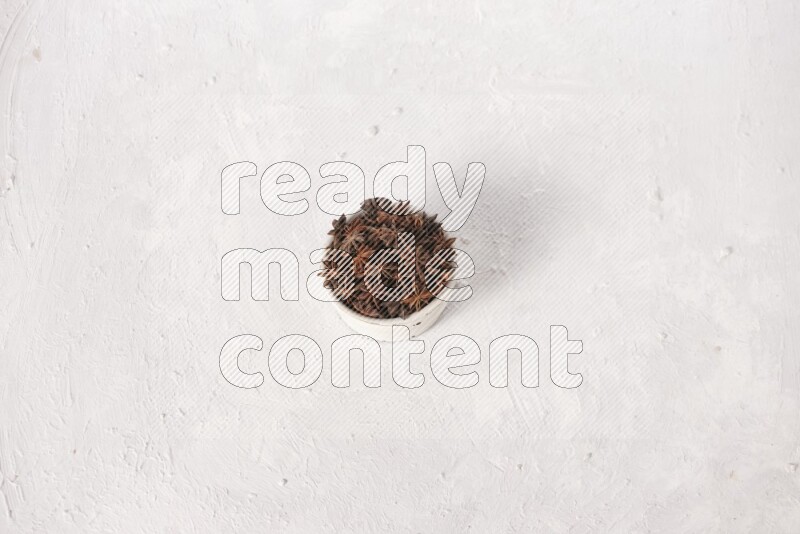 Star Anise in a white bowl on white background