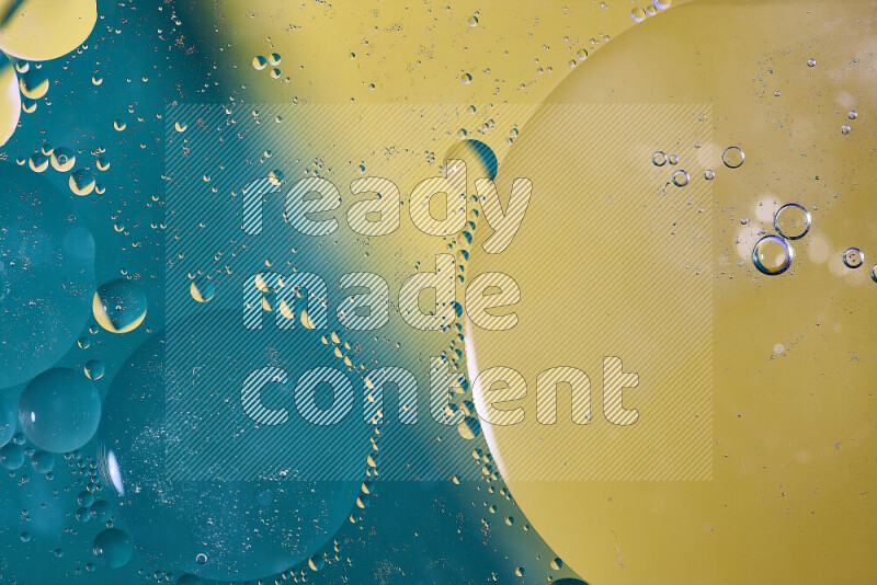 Close-ups of abstract oil bubbles on water surface in shades of blue and yellow