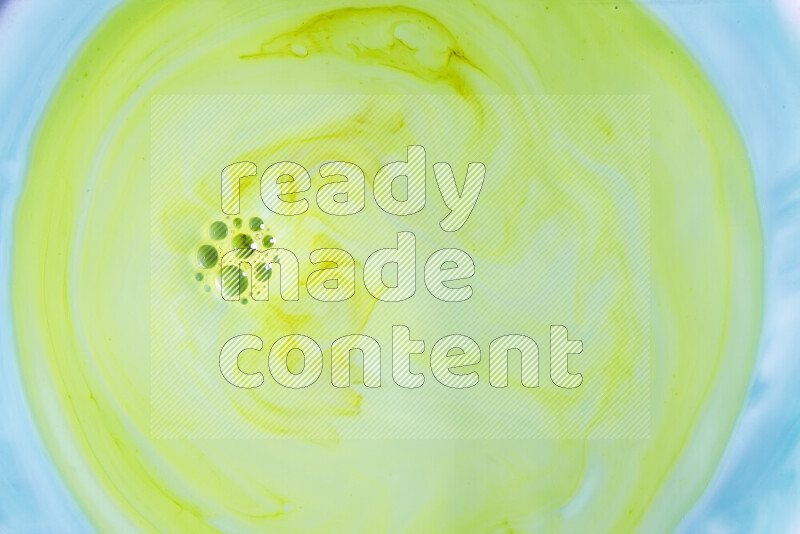 A close-up of abstract swirling patterns in green gradients