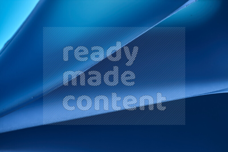 An abstract art piece displaying smooth curves in cold gradients created by colored light