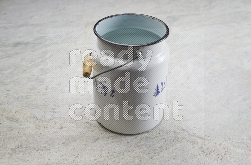 A vintage milk can on grey marble background