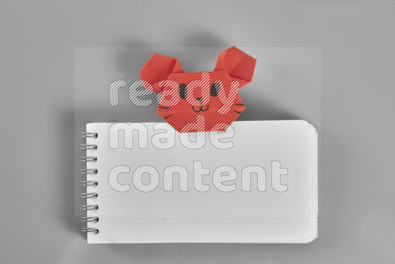 Origami animals on grey background