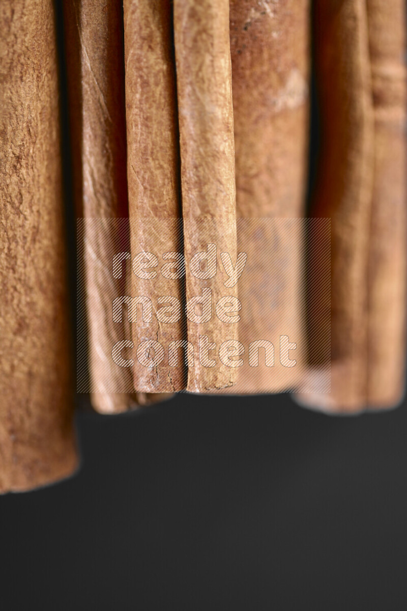Cinnamon sticks on black background