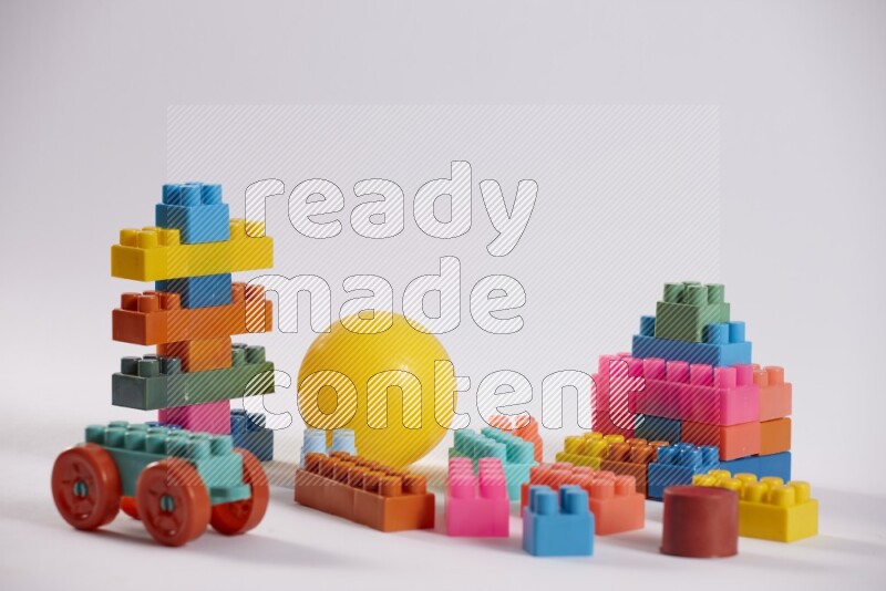 Collection of colorful different kids toys on white background