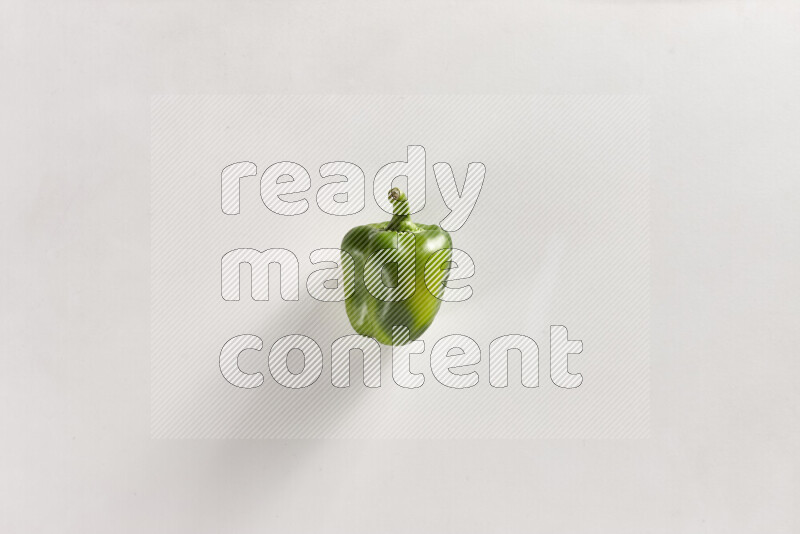 Green bell pepper on white background