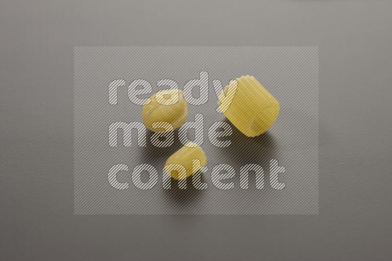 Different pasta types on grey background