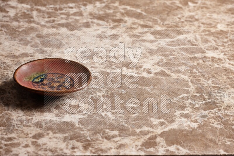 Decorative Pottery Plate on Beige Marble Flooring