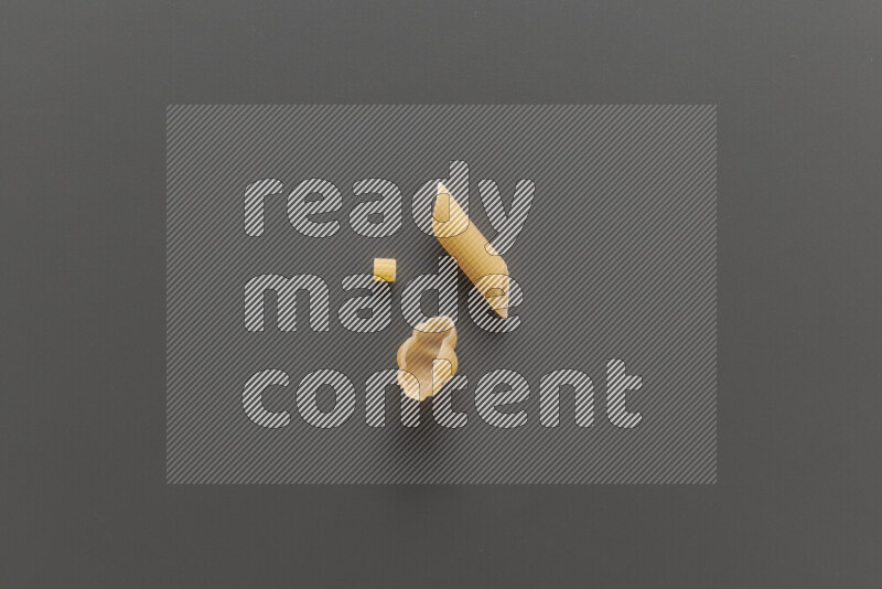 Different pasta types on grey background