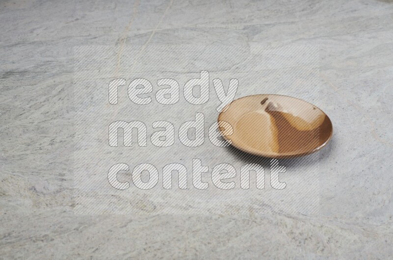 Multicolored Pottery Plate On Grey Marble Flooring