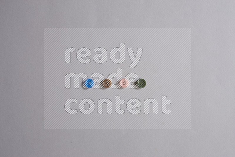 Multicolored buttons placed on grey background
