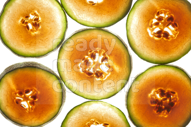 Cantaloupe slices on illuminated white background