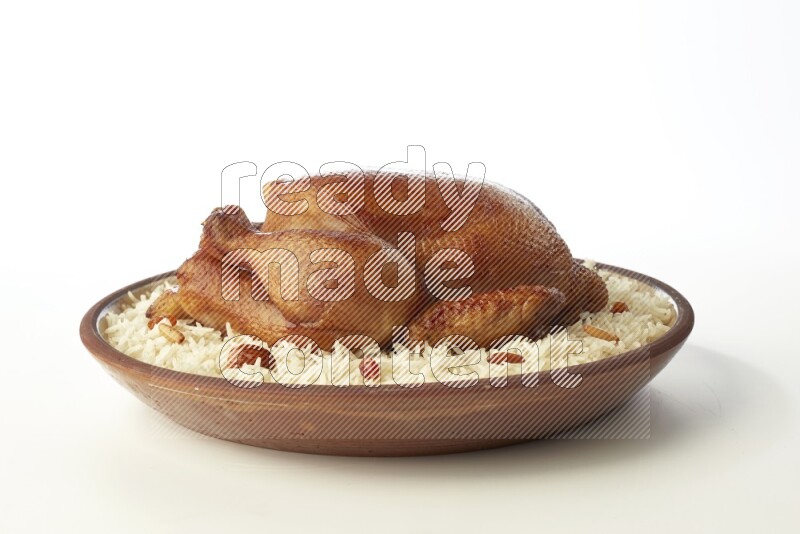 white  basmati Rice with  whole roasted chicken    on a pottery plate  direct  on white background