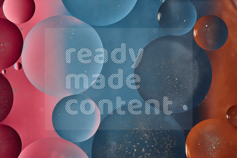 Close-ups of abstract oil bubbles on water surface in shades of blue, orange and pink