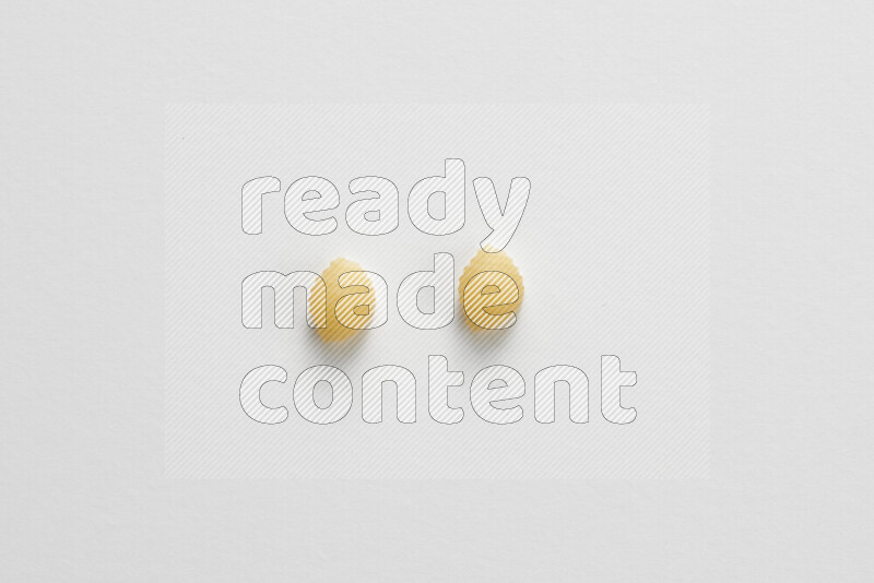 Shells pasta on white background