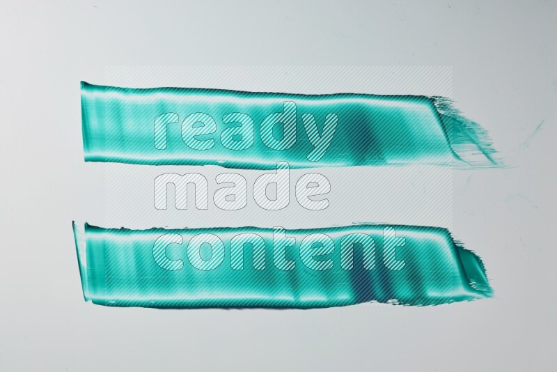Turquoise painting knife strokes on white background