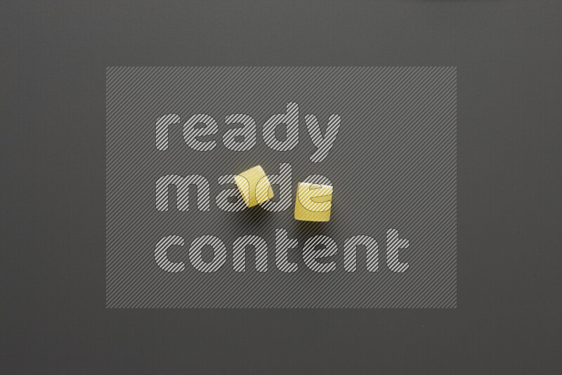 Big rings pasta on grey background