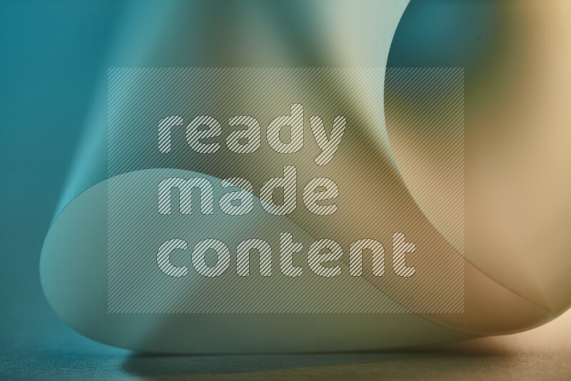 An abstract art piece displaying smooth curves in green and yellow gradients created by colored light