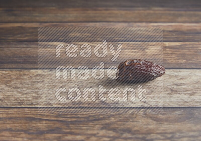 one madjoul date on a wooden background