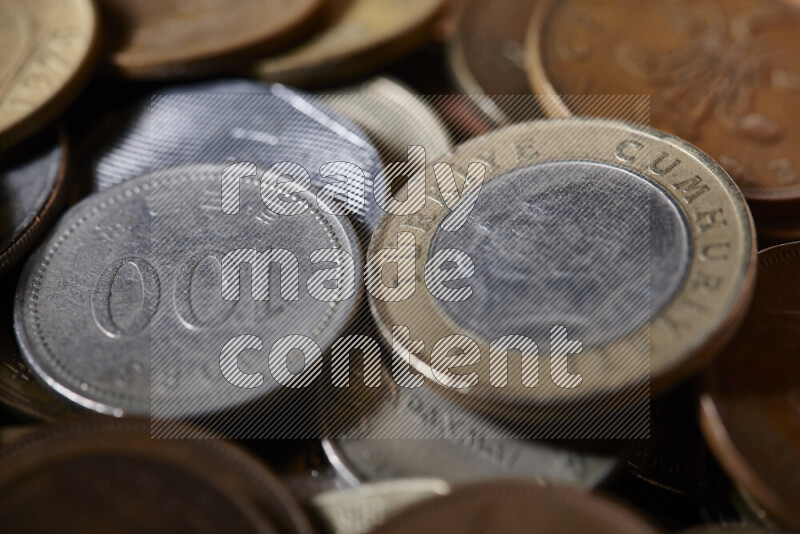 A close-ups of random old coins on black background