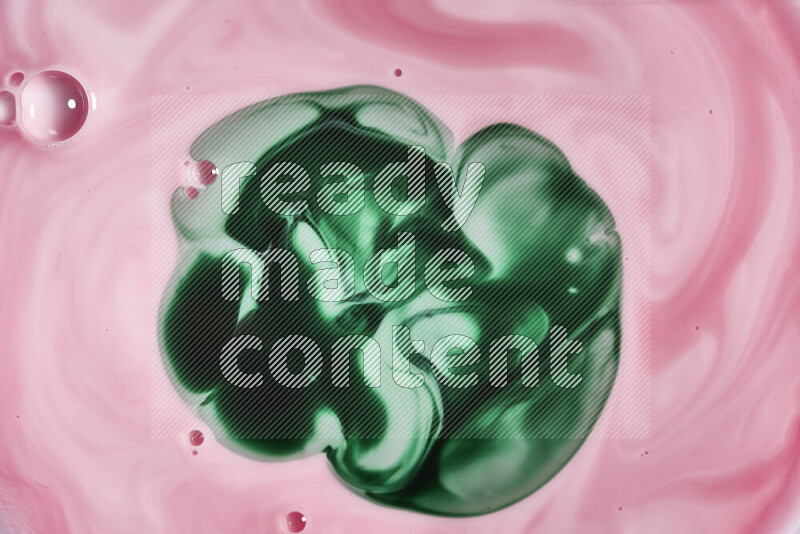 A close-up of abstract swirling patterns in red and green