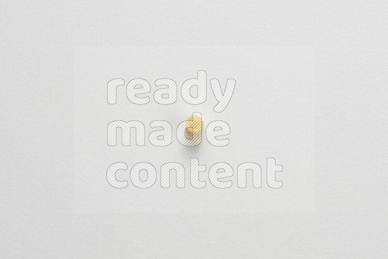 Small rings pasta on white background