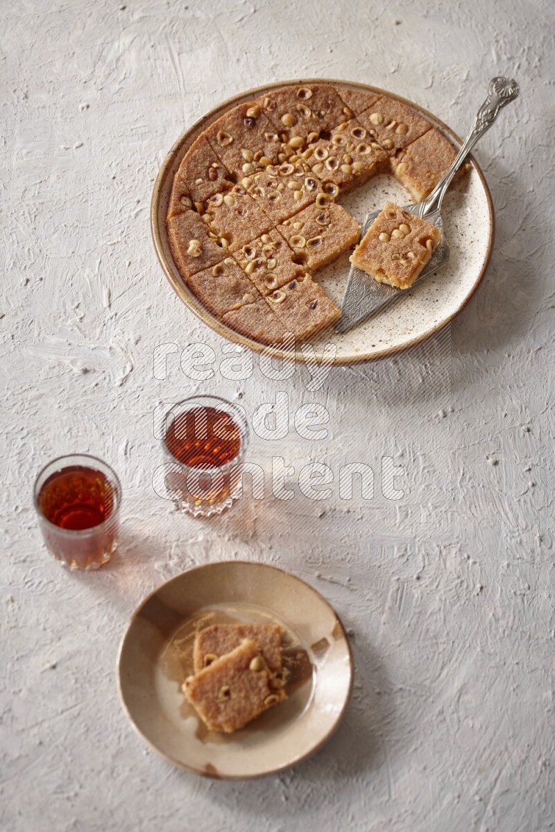 Basbousa with tea in a light setup