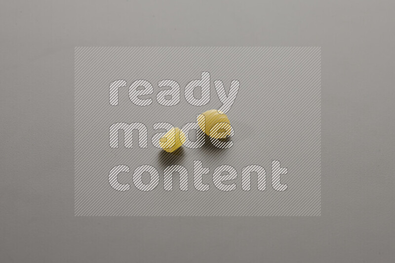 Small rings pasta with other types of pasta on grey background