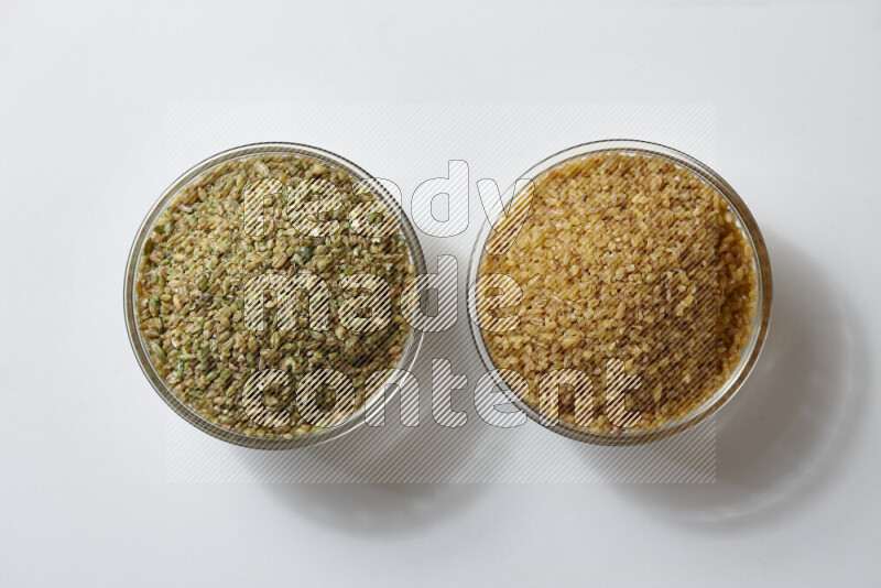 Coarse bulgur with freekeh on white background