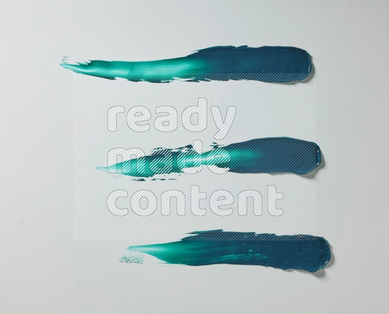 Turquoise painting knife strokes on white background