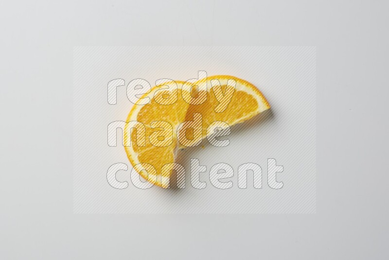 Two halves of an orange slices on white background