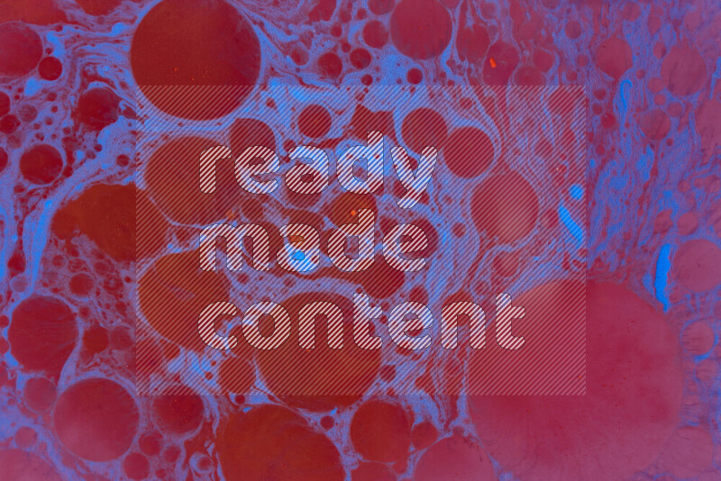 The image depicts a marbling effect with swirling patterns of red and blue