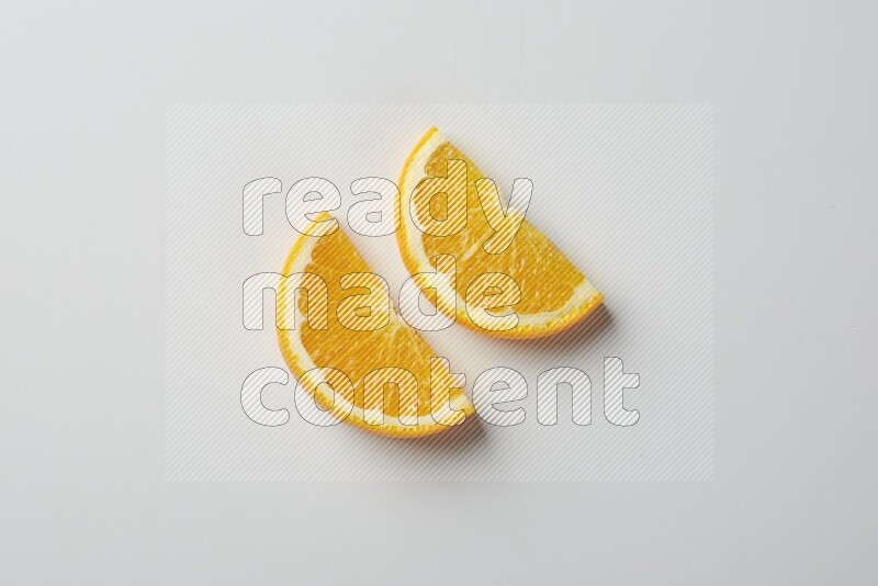 Two halves of an orange slices on white background