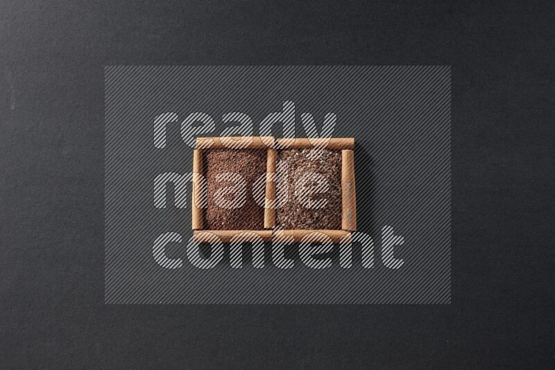 2 squares of cinnamon sticks full of garden cress and flaxseeds on black flooring