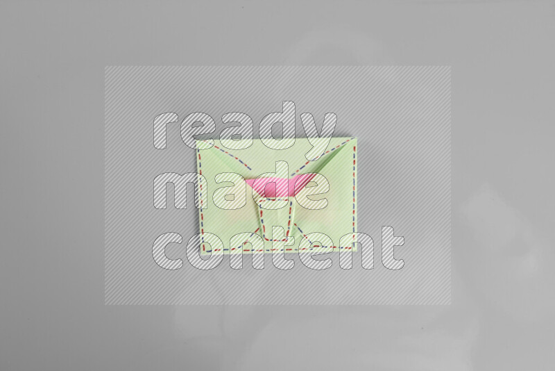 Origami envelope on grey background
