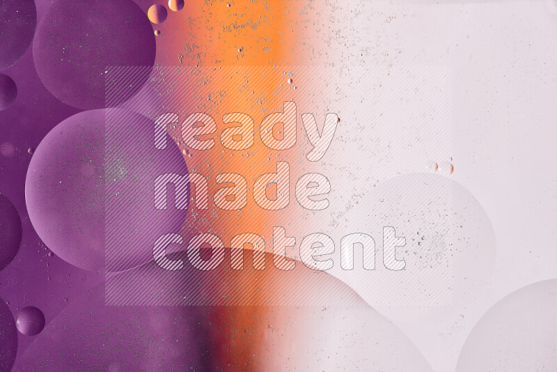 لقطات مقربة لفقاعات من الزيت على سطح الماء باللون الأبيض والبرتقالي والأرجواني