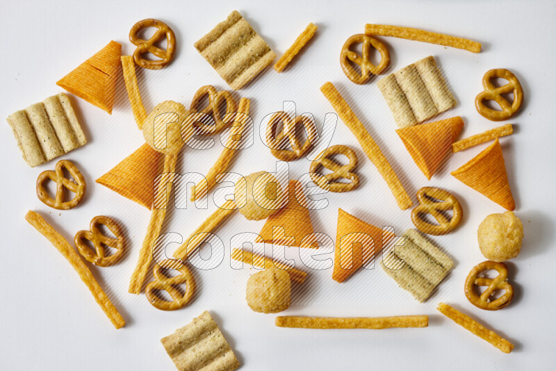 Assorted snacks on white background