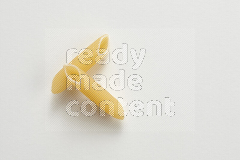 Penne pasta on white background